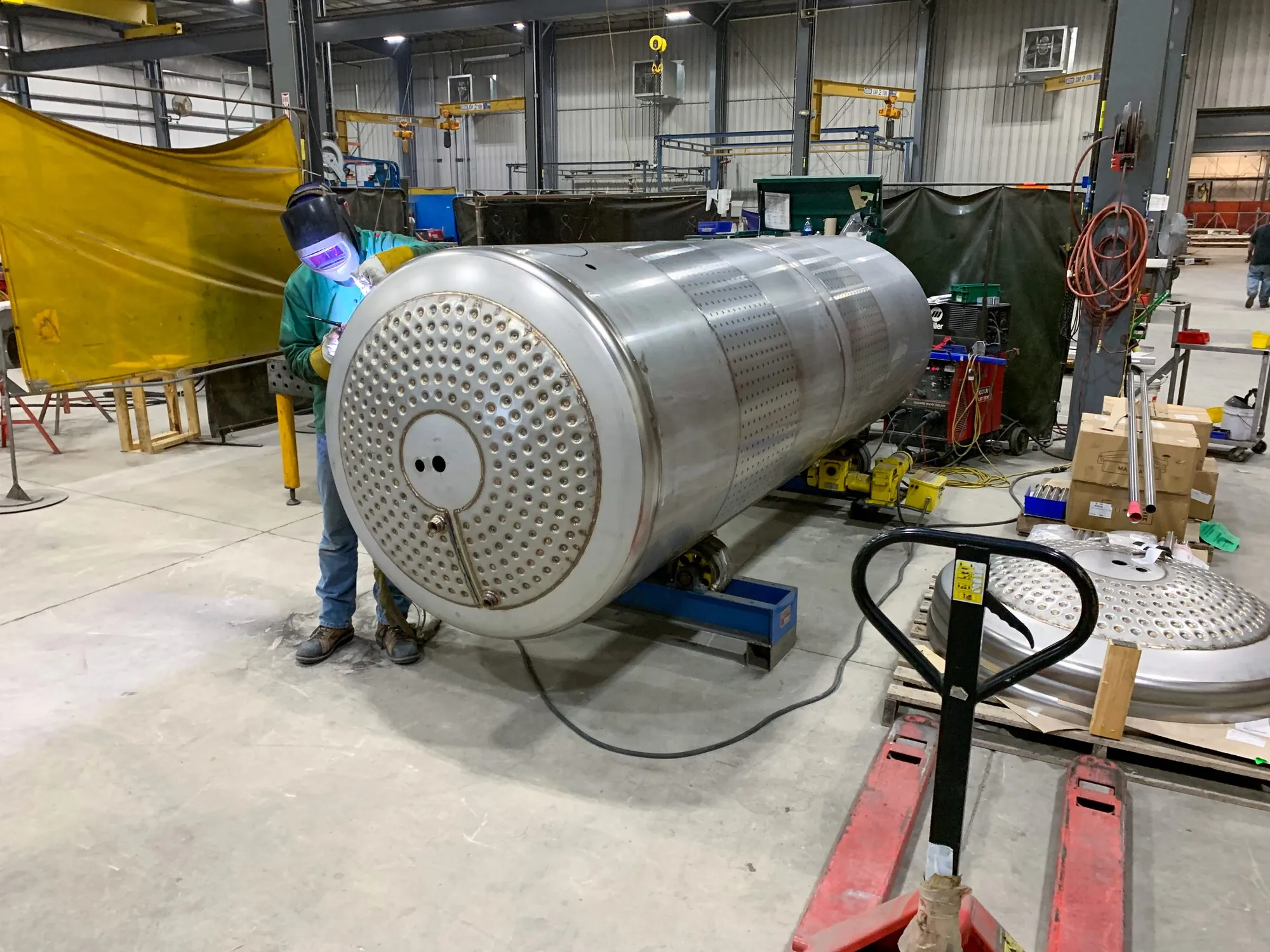 Northern Manufacturing welder running a manual GTAW pass on a stainless steel heat exchanger tubesheet