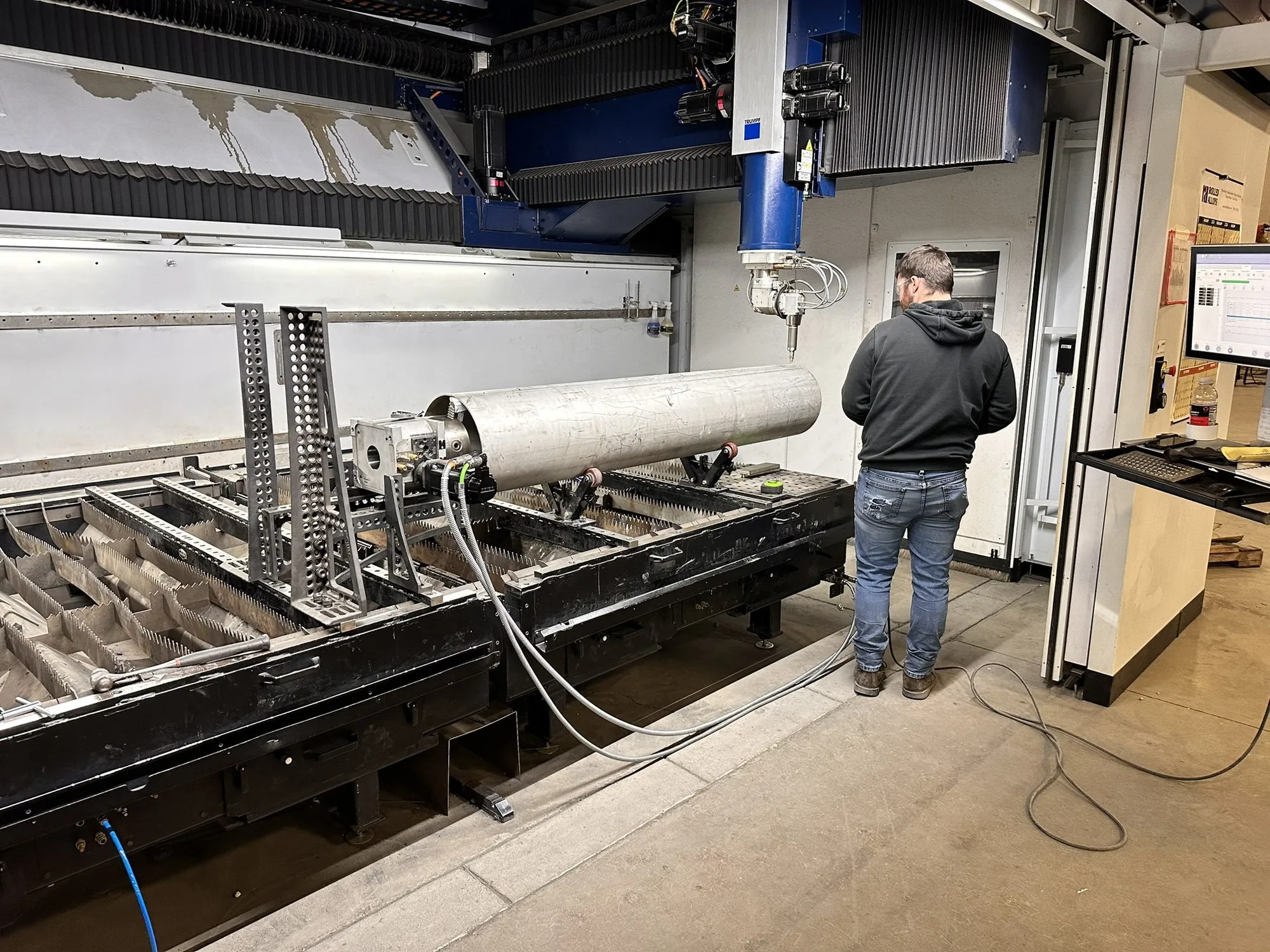Slotted 316L stainless steel instrument tubes on a work table at Northern Manufacturing