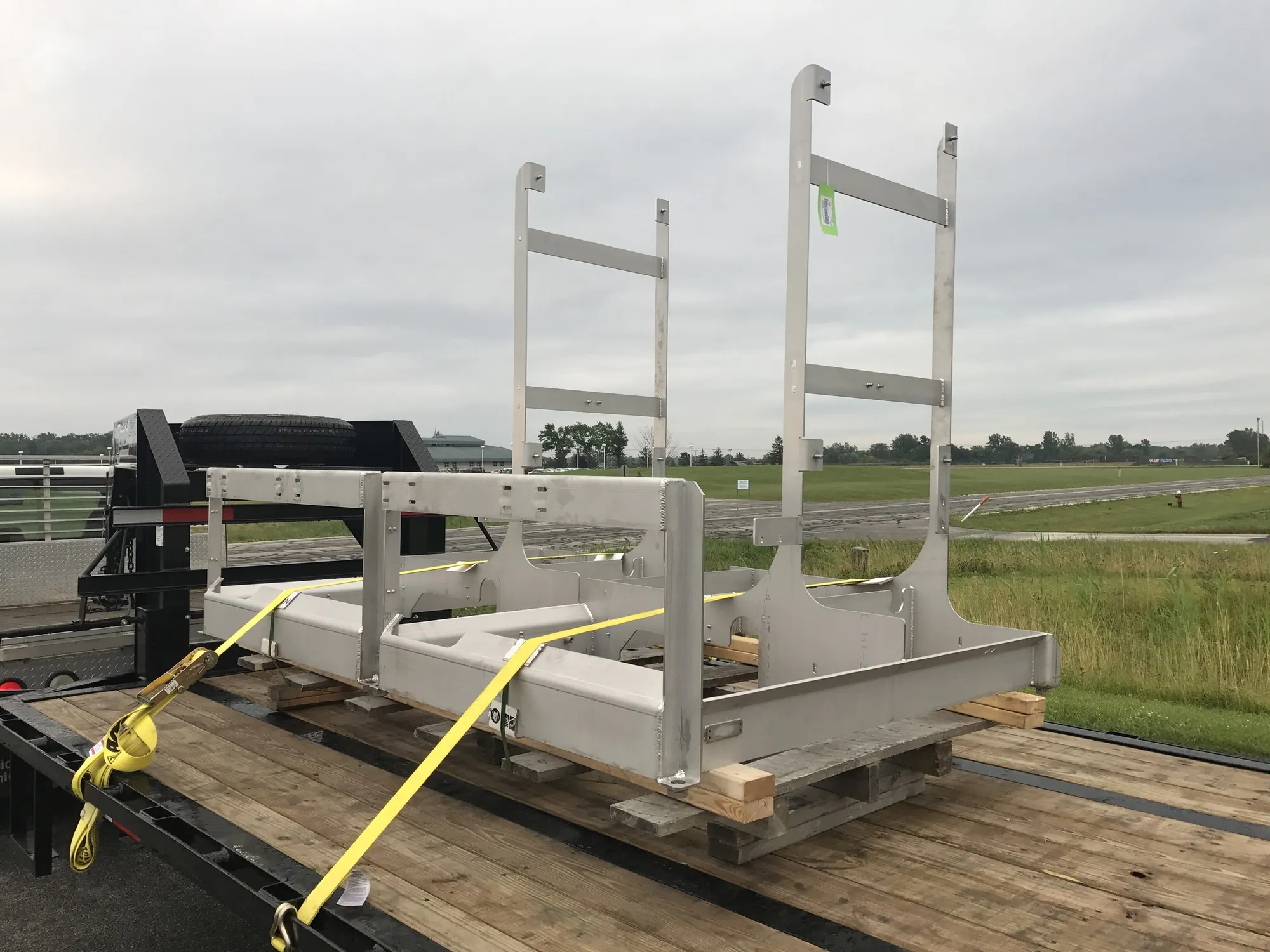 Stainless steel food processing frame loaded on a trailer in the outdoor lot at Northern Manufacturing