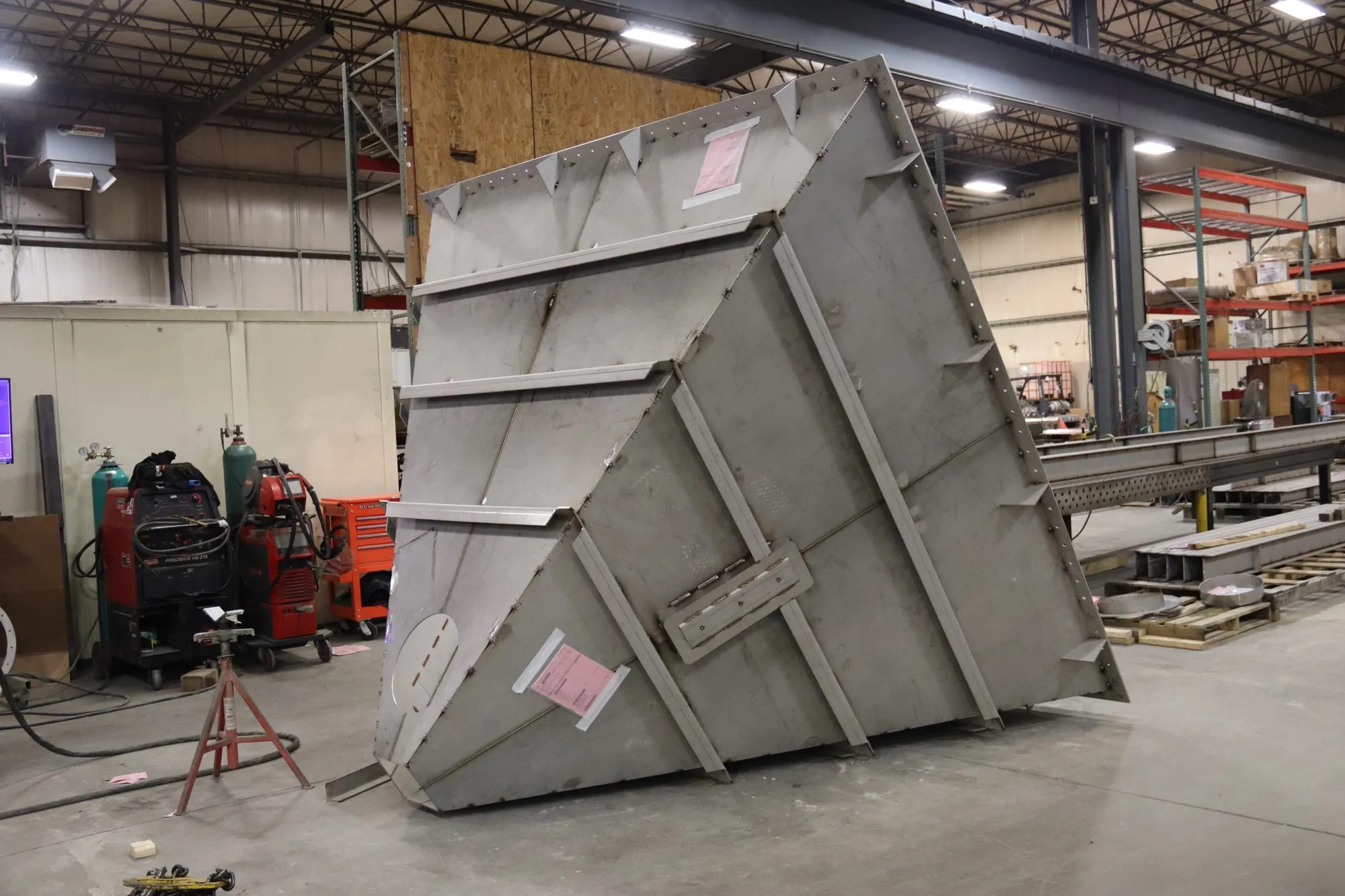 Rib-stiffened stainless steel hopper transition piece in the fabrication bay