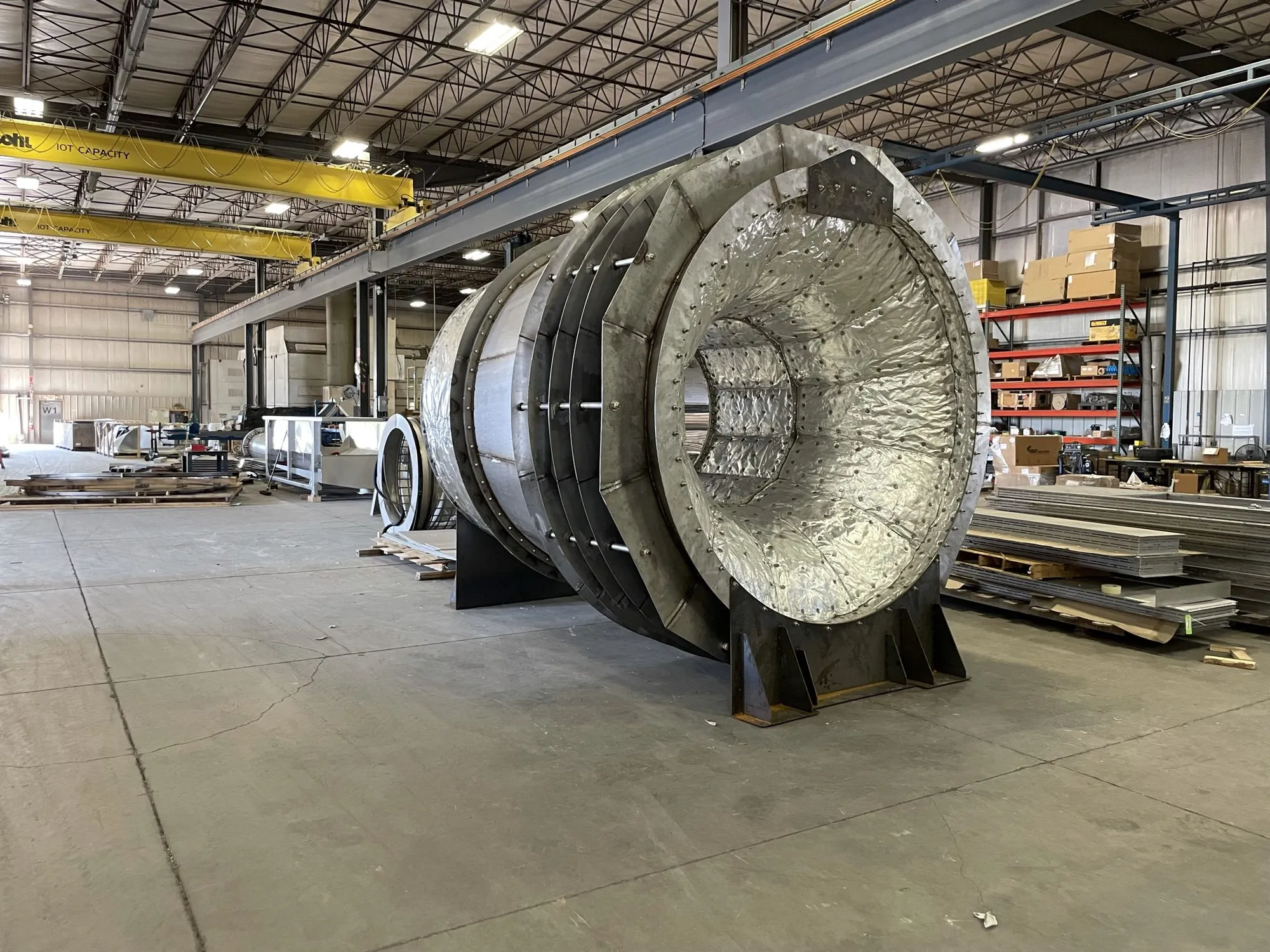 Large stainless steel exhaust diffuser with internal baffle rings in Northern Manufacturing's fabrication bay