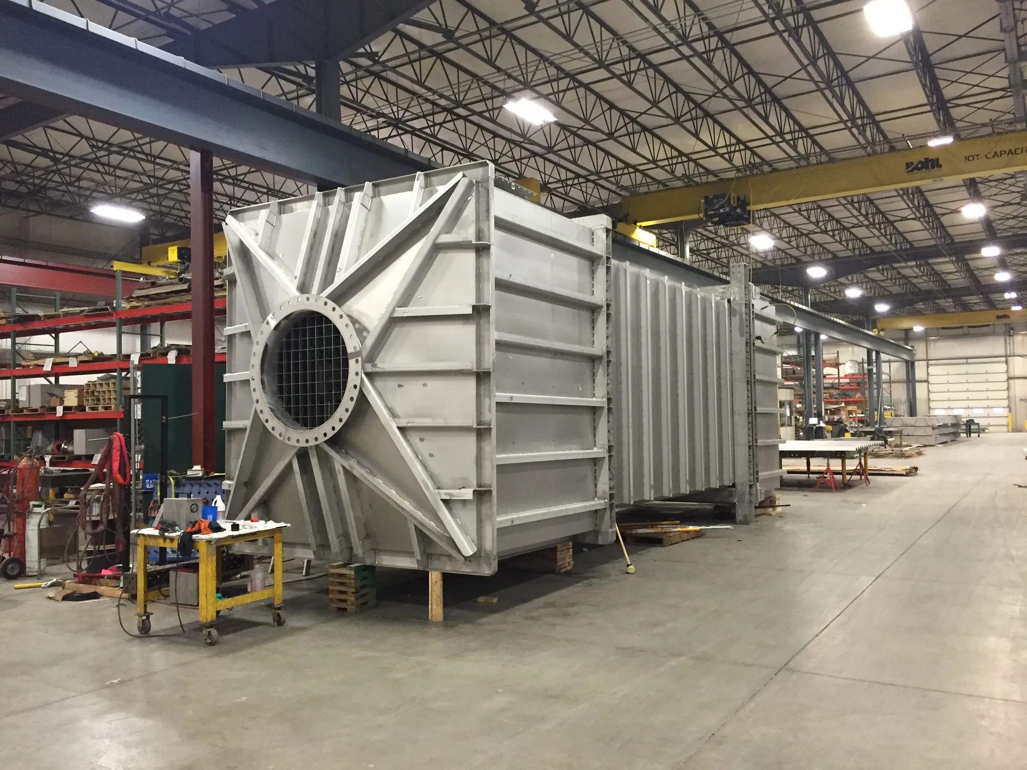 Painted-steel WESP module with plenums on both ends, fully assembled for trial-fit in the Northern Manufacturing fabrication bay