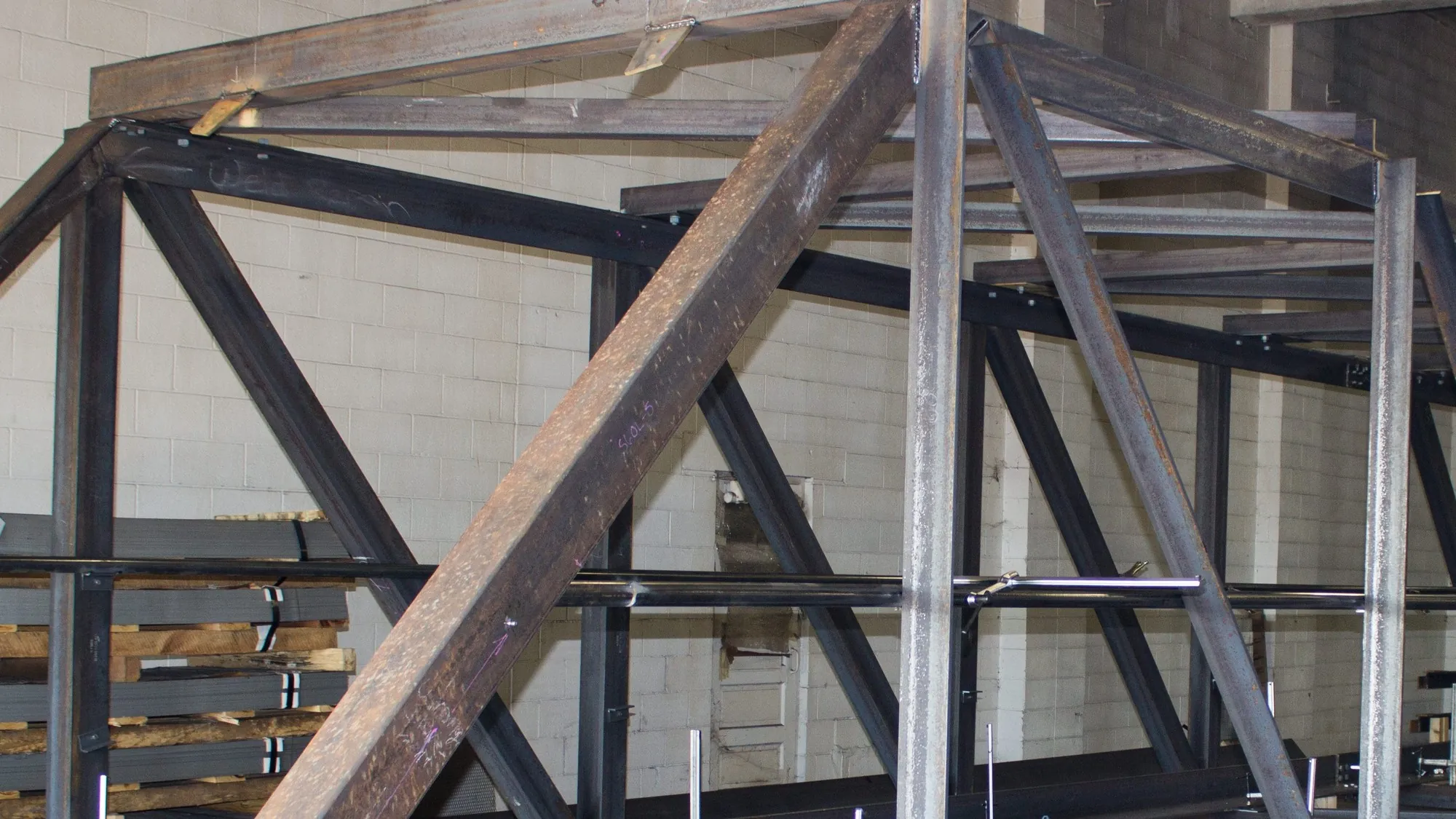 long structural frame staged in the Northern fabrication bay