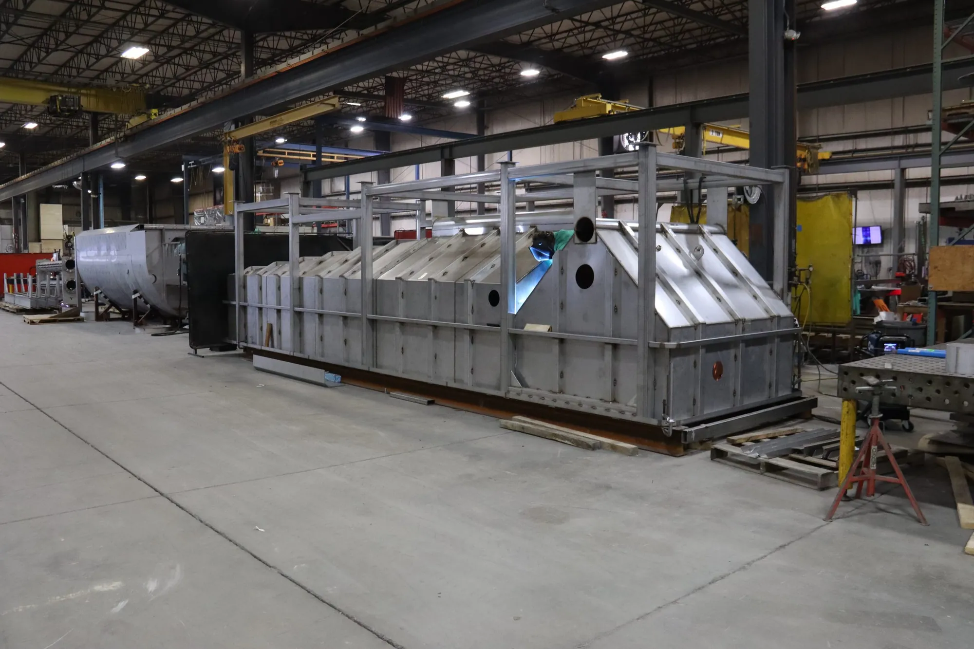 Stainless steel clarifier unit with V-shaped baffles in the Northern Manufacturing fabrication bay