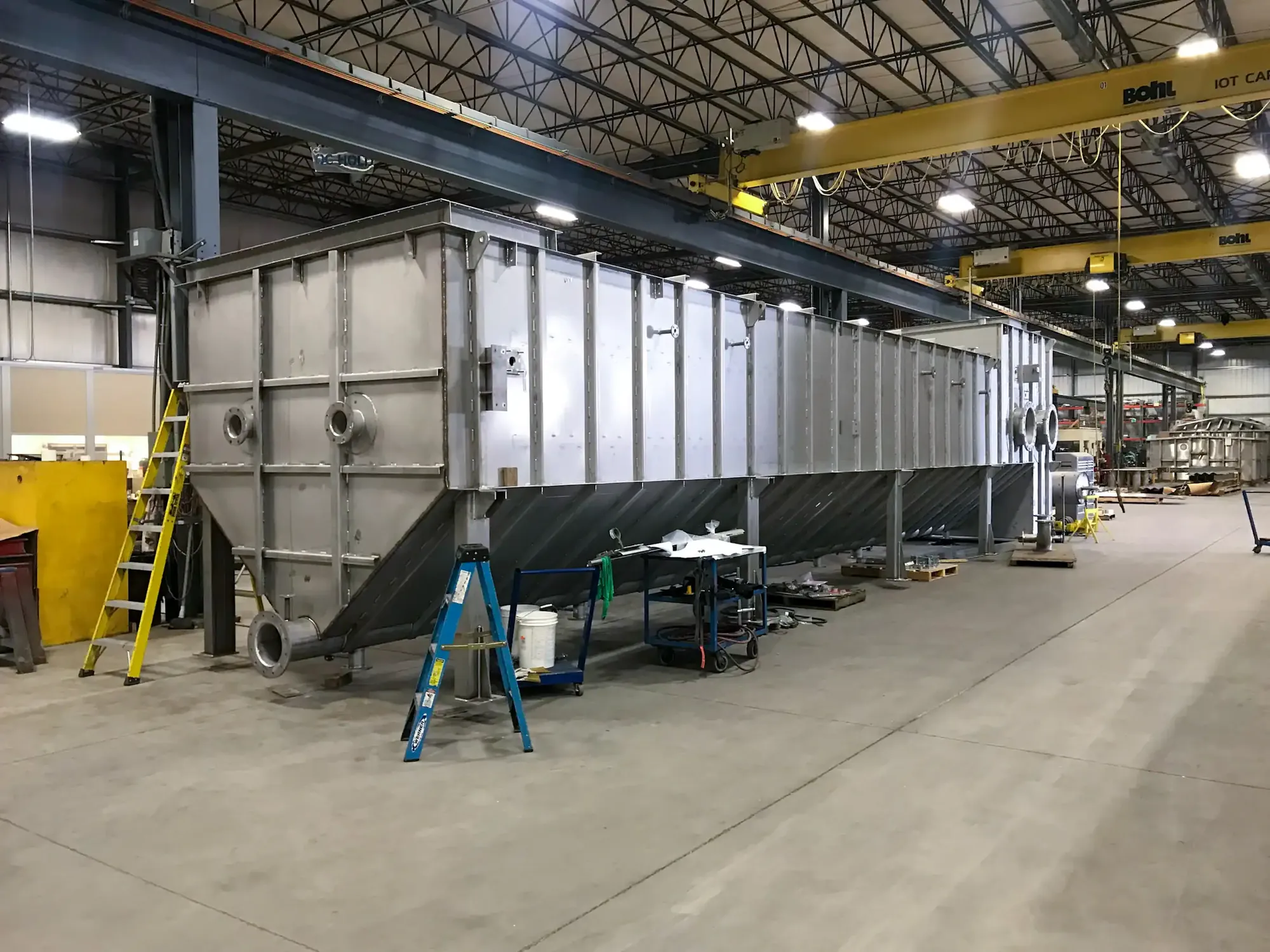 Heavy stainless steel fabrication under an overhead crane at Northern Manufacturing